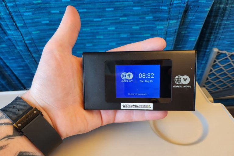 Pocket WiFi device held on a Japanese train