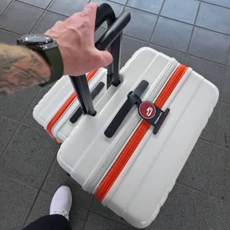 Traveler with a suitcase on a Japanese station platform